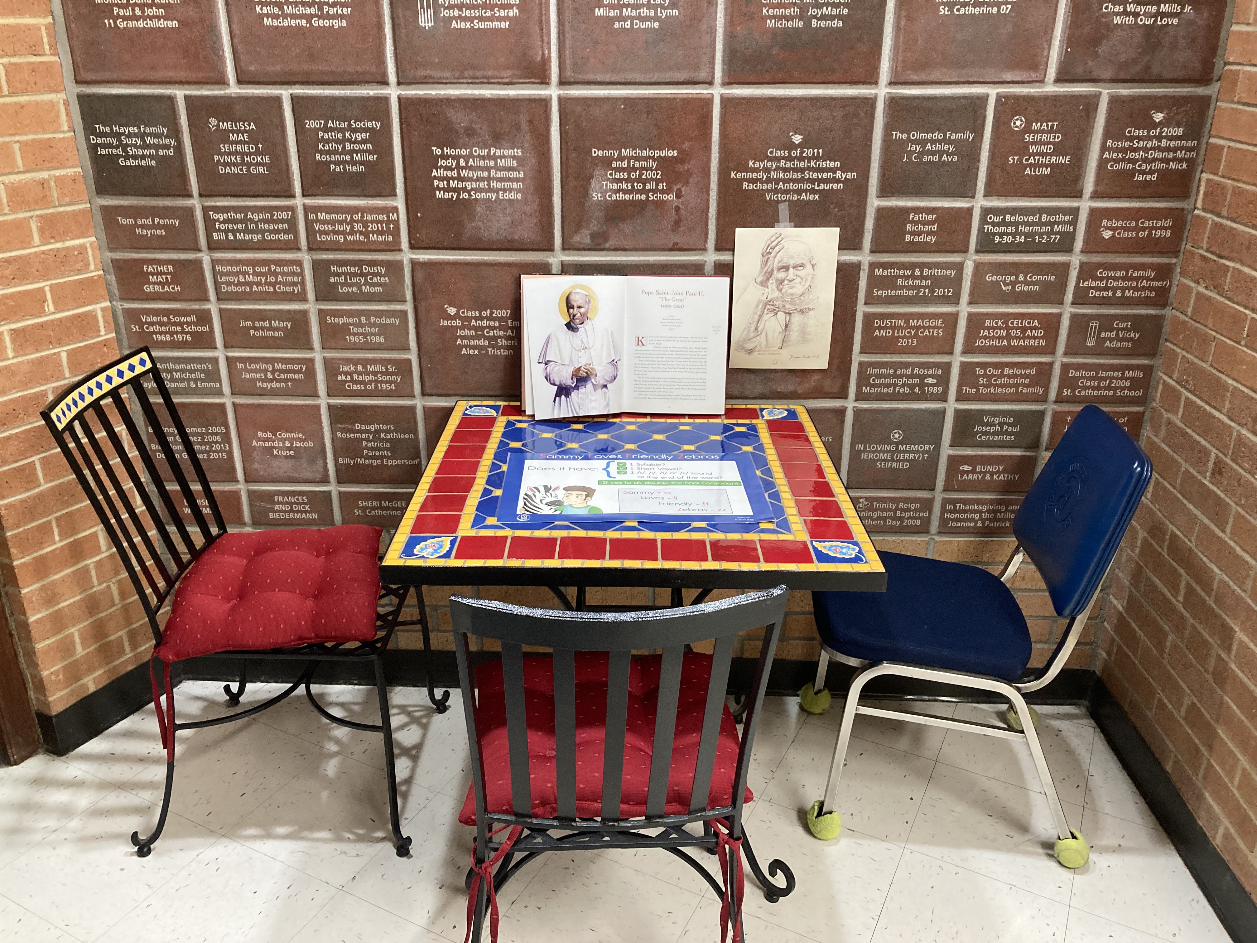 Image of the mini-shrine dedicated to Pope Saint John Paul II in Sr. Christina’s “office” in the hallway