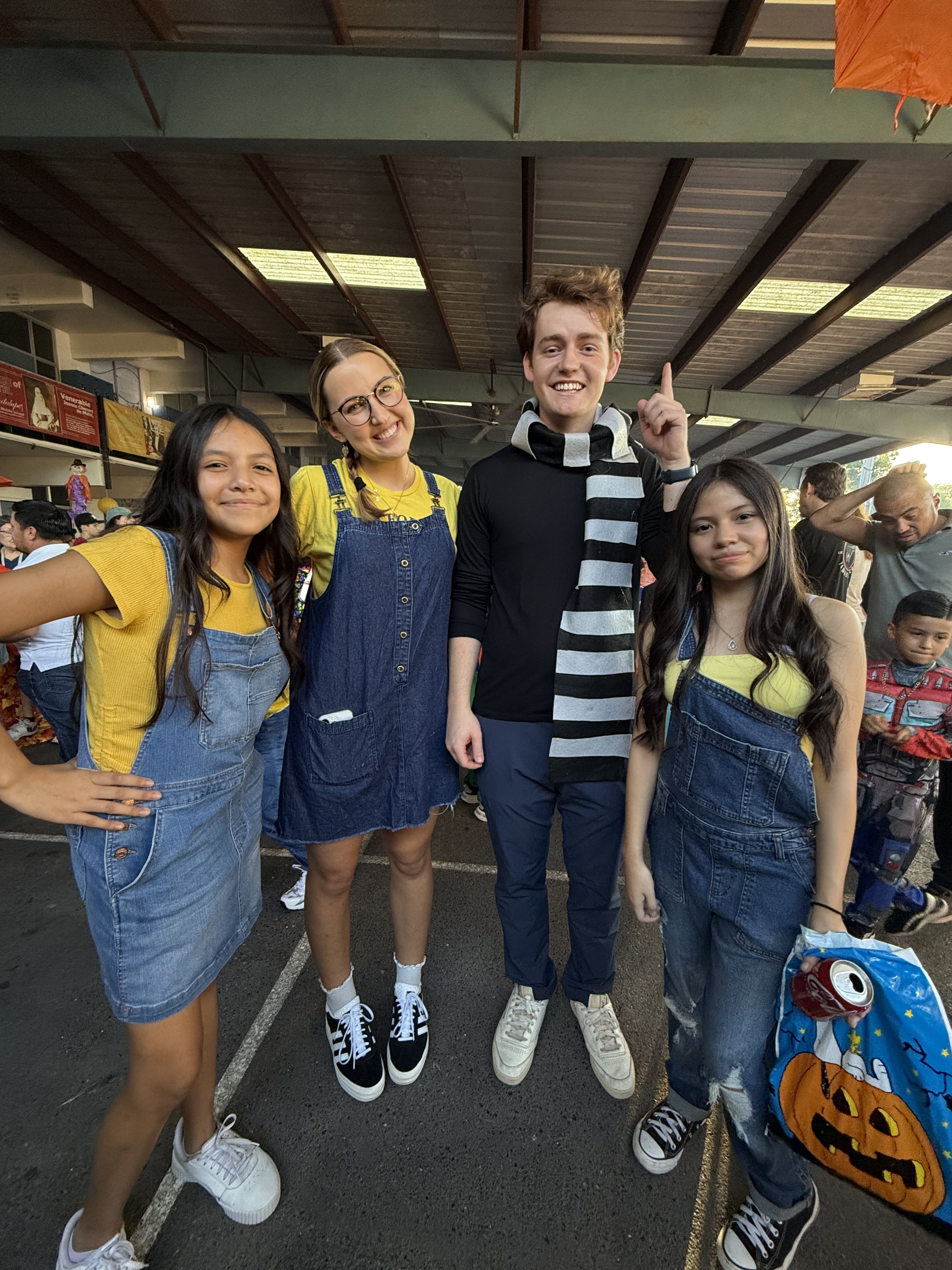 Aidan Anderson, Maddie Schlehuber with students at their school