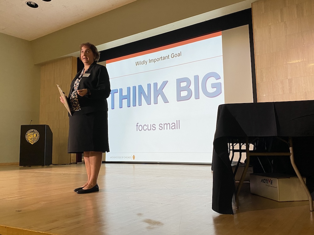 Jodi McLawhorn giving a presentation on stage