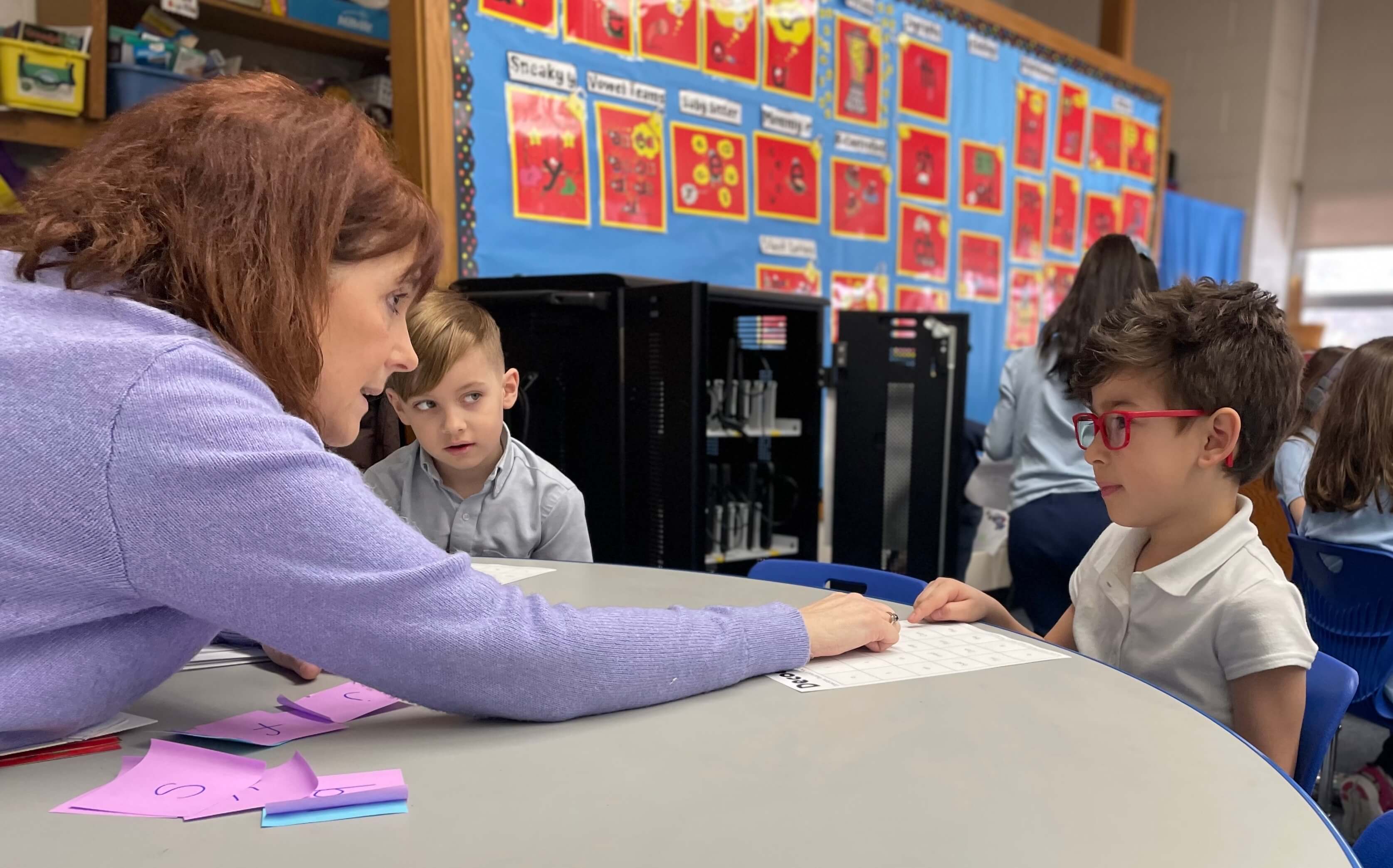 Teacher Working with HPL Student