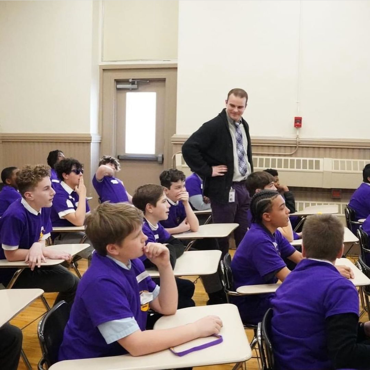 Tyler Johnson with his students in class