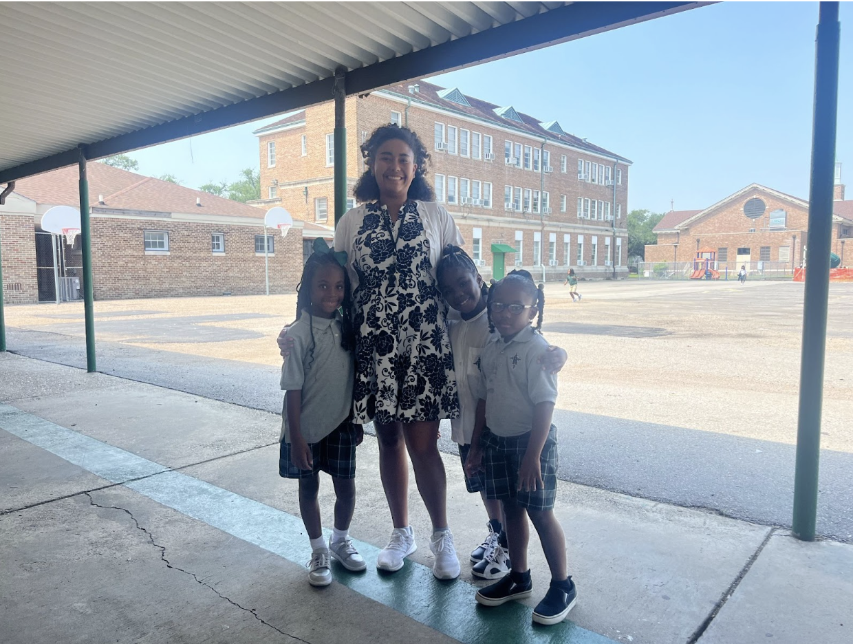 Sydney Brown with three of her students