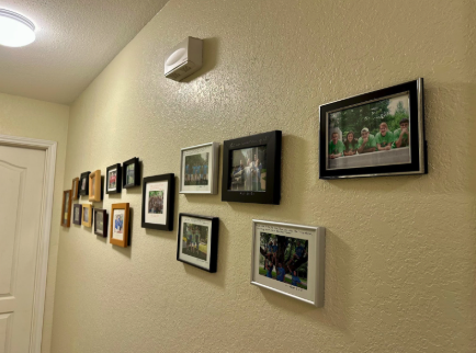 Past ACE Brownsville community photos on the house walls