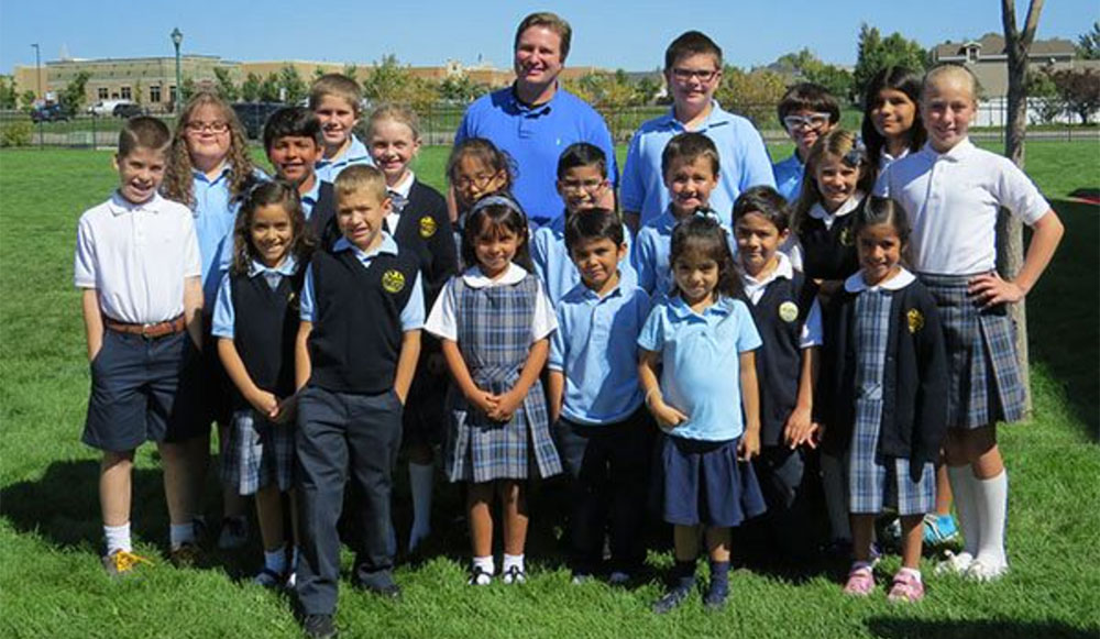 Patrick Jefferies, center, as the new principal of Saint Andrew Catholic School in Riverton, UT. IC Photo: Laura Vallejo