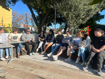 Students sitting with Homeboy Industries