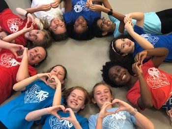 Sacred Heart students laying in circle