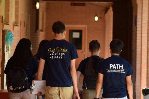 Student with matching shirts walking together