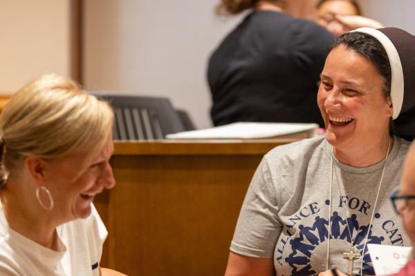 Sr. Daniela laughing with ACE Principal Academy fellows in class