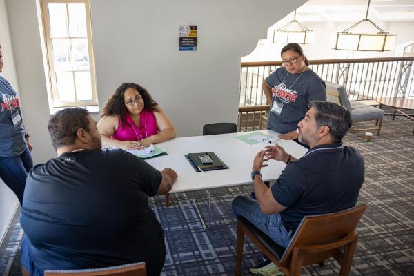 LEAD members listening to their mentor