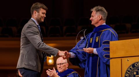 Dominic Fanelli receiving Pressley Award from John Staud