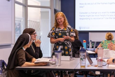 Betsy Okello talking to Remick students in summer class