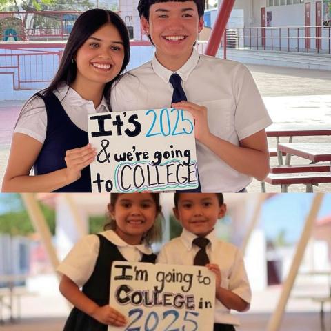 Two students holding sign