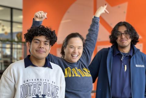 Emily with students in ND gear