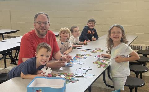 Eric with children and puzzle