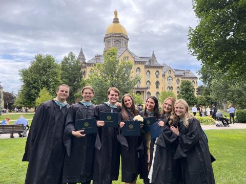 ACE Teachers outside the Main Building in regalia