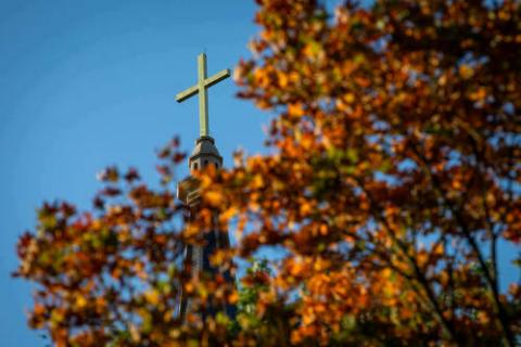 Cross above fall foliage