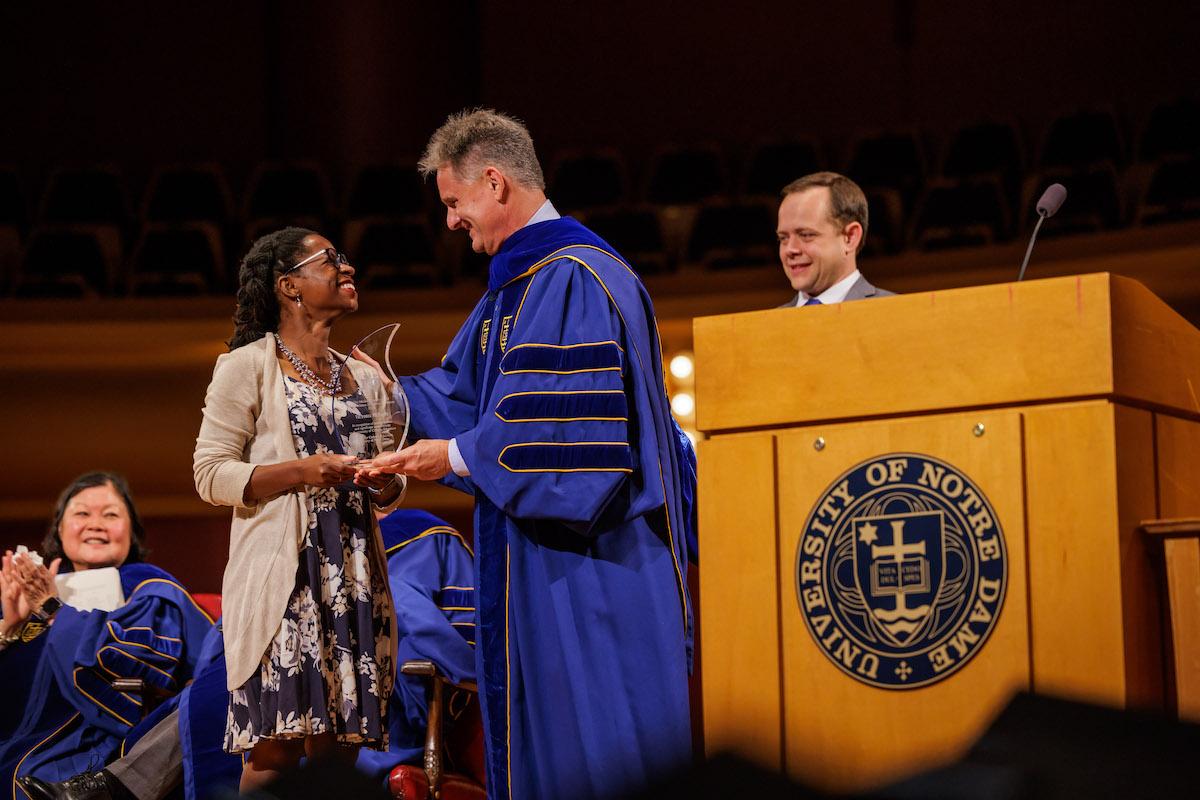 Vickey McBride receiving Pressley Award from John Staud