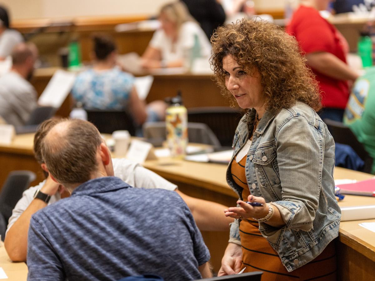 Nikki Raftery talking with an ACE Principal Academy fellow in class