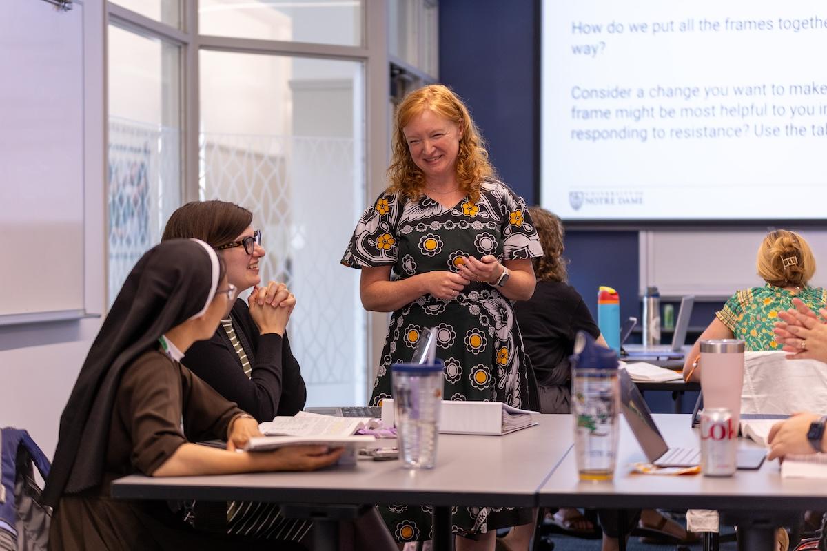 Betsy Okello talking to Remick students in summer class