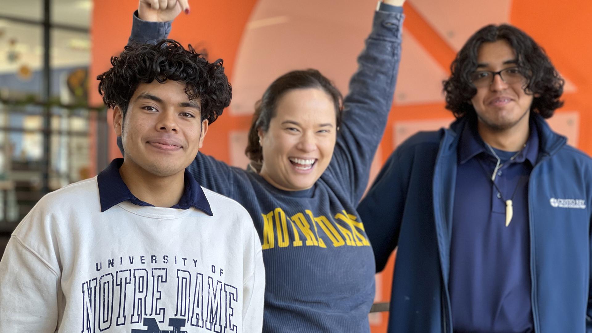 Emily with students in ND gear