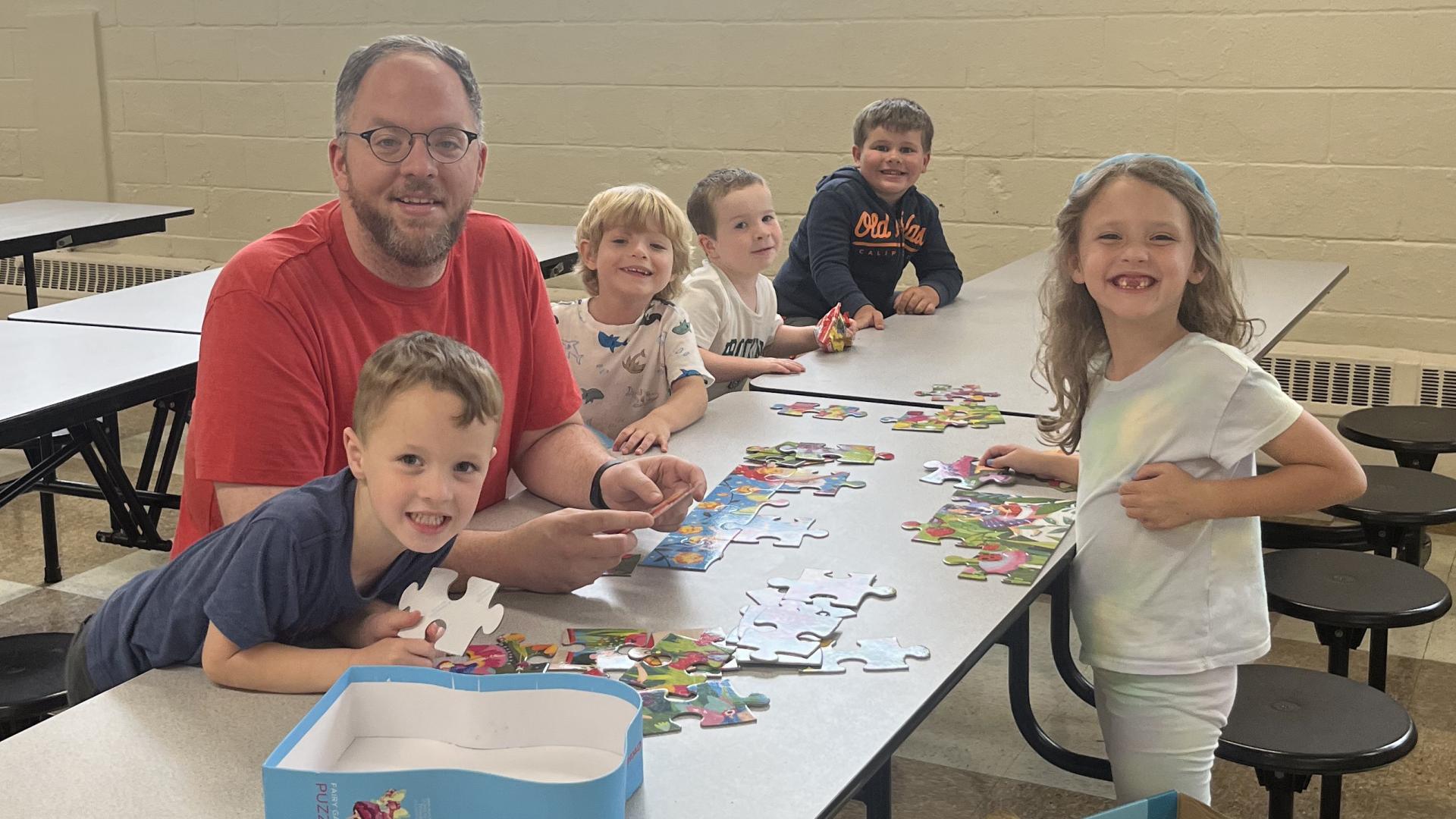 Eric with children and puzzle