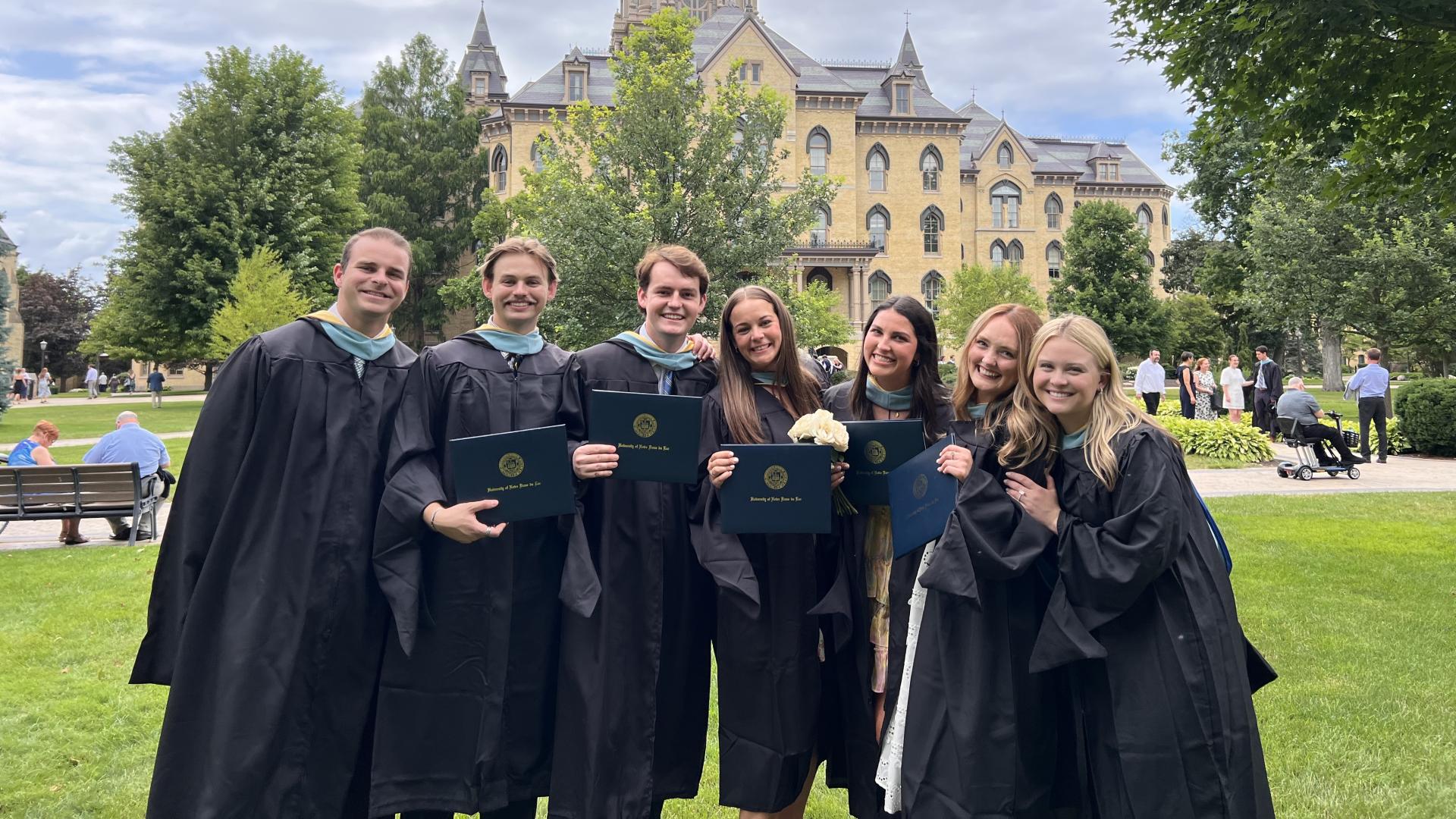 ACE Teachers outside the Main Building in regalia
