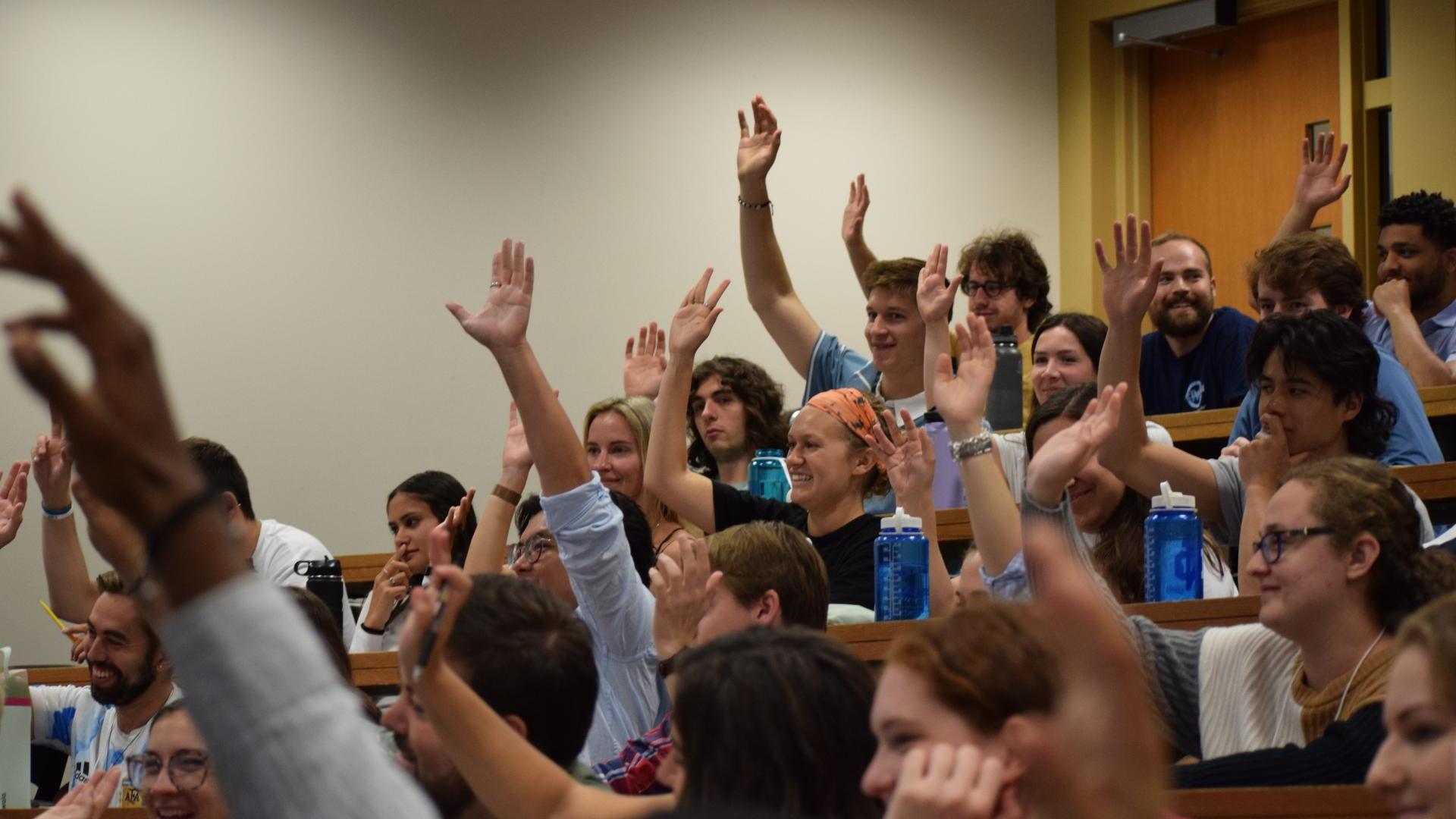 ACE Students raising hands