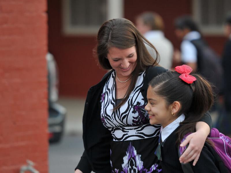 Teacher smiling with student